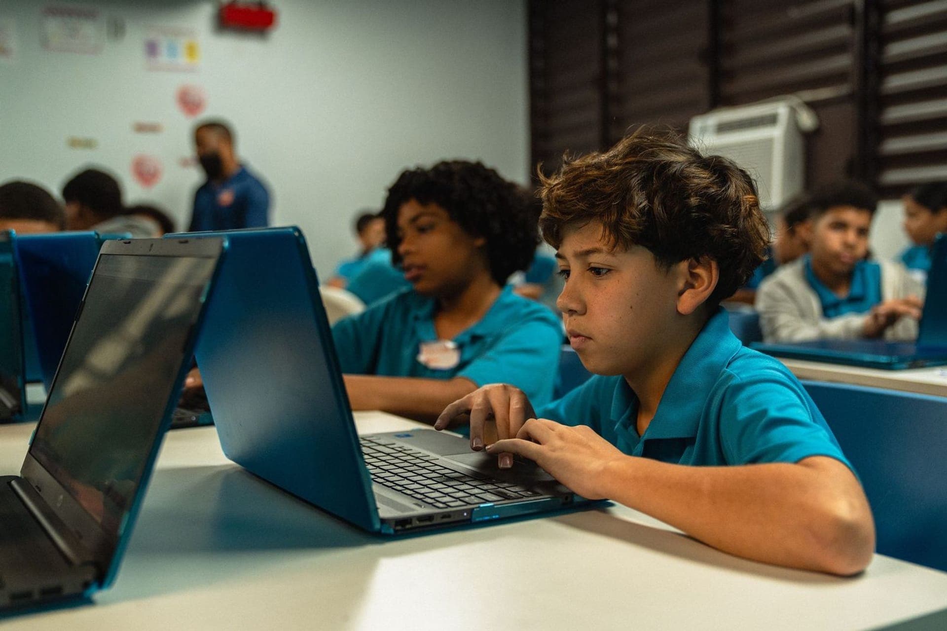 Students coding on laptops