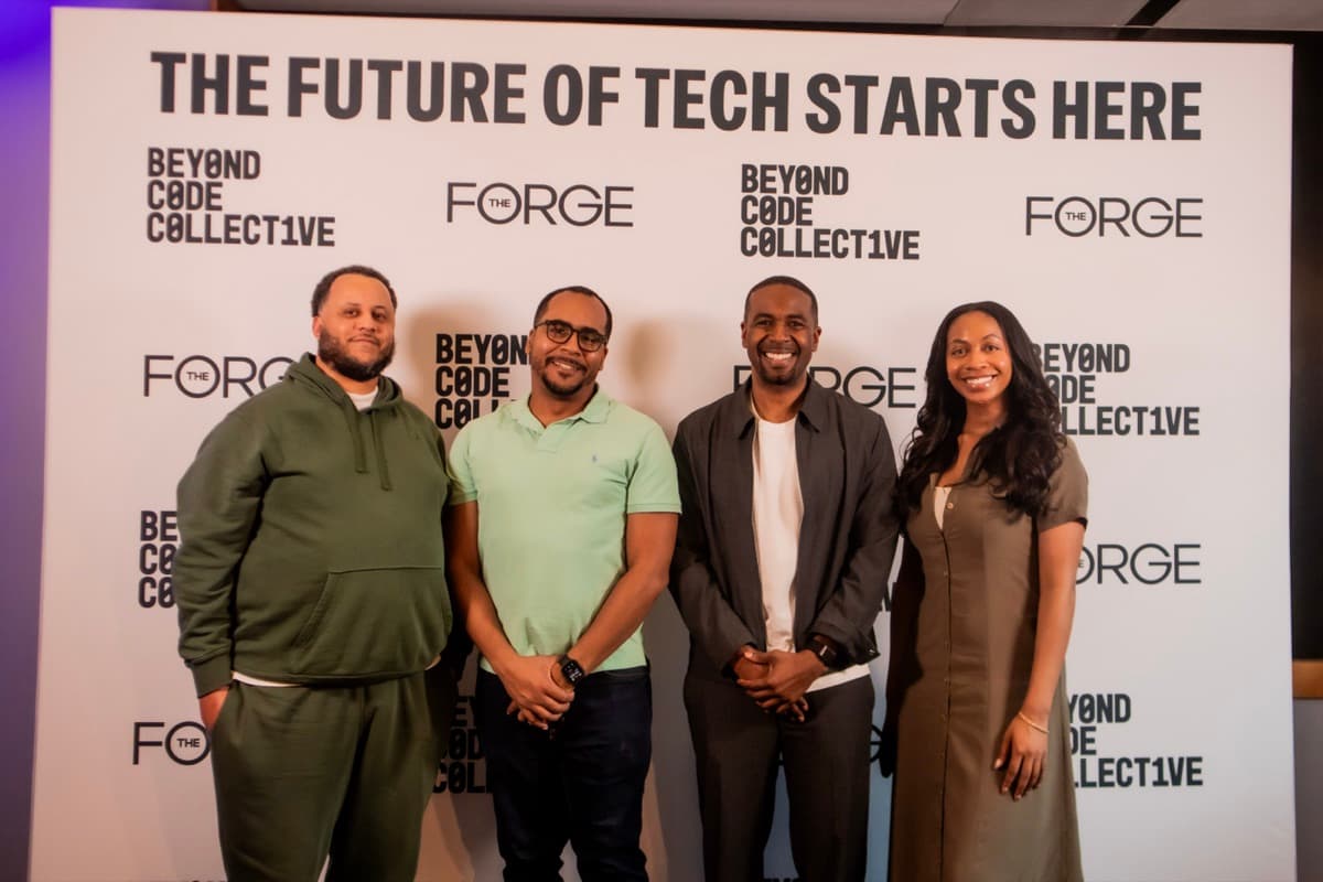 Four attendees at The Forge step and repeat