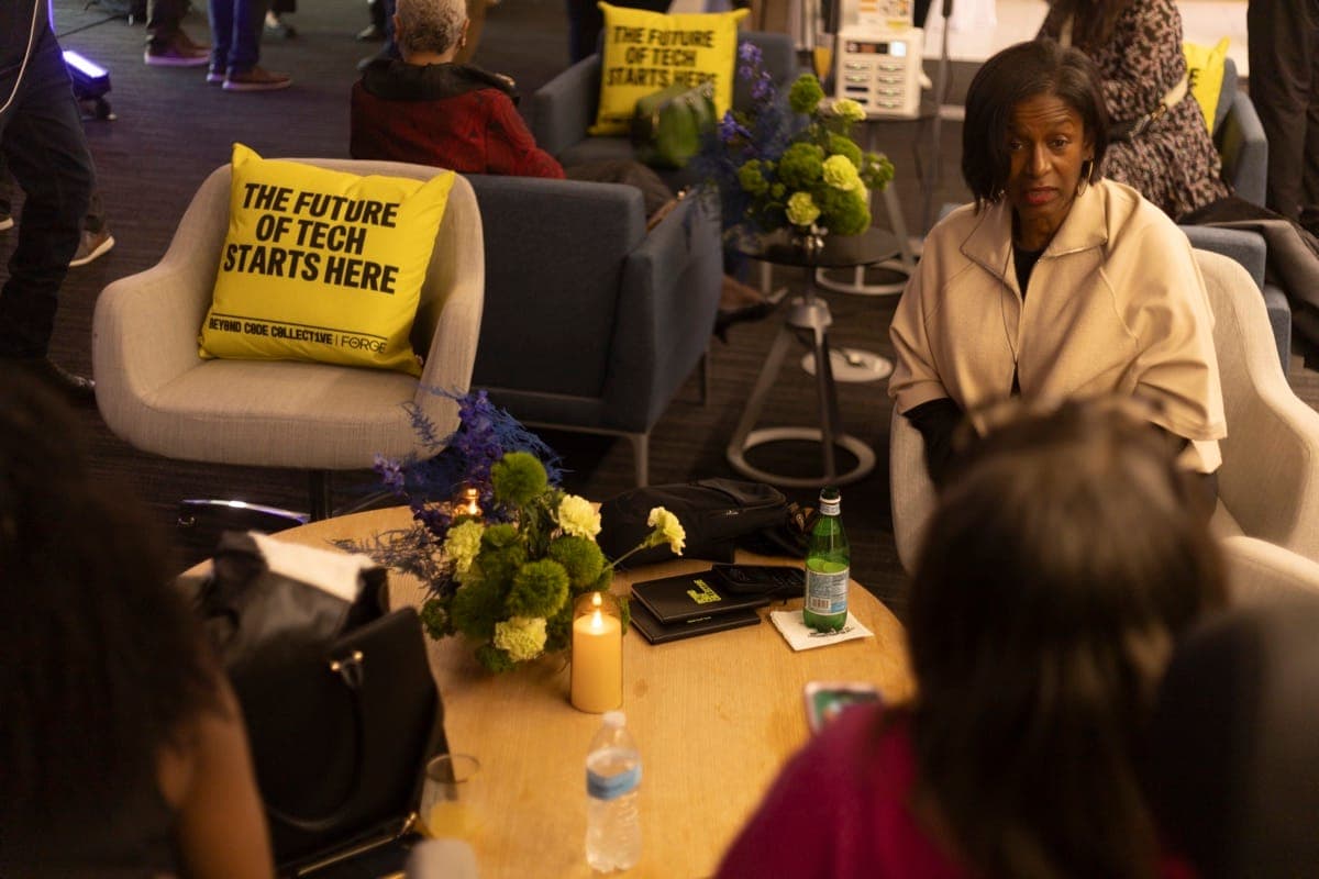 Community members in conversation at The Forge lounge